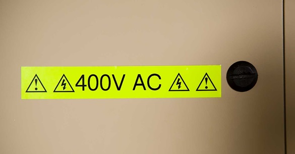 Brother fluorescent tape warning sign showing 400 volts AC