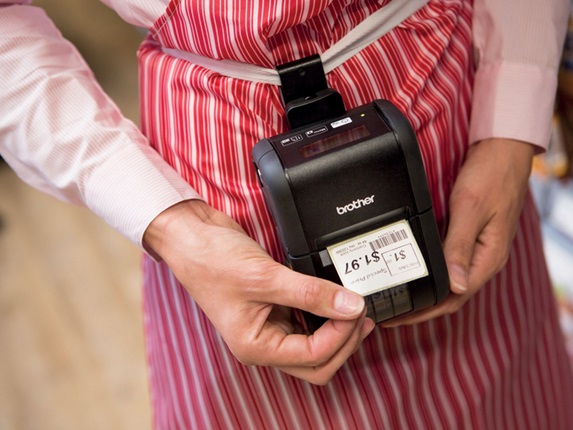 Brother RJ portable label printer producing barcode label